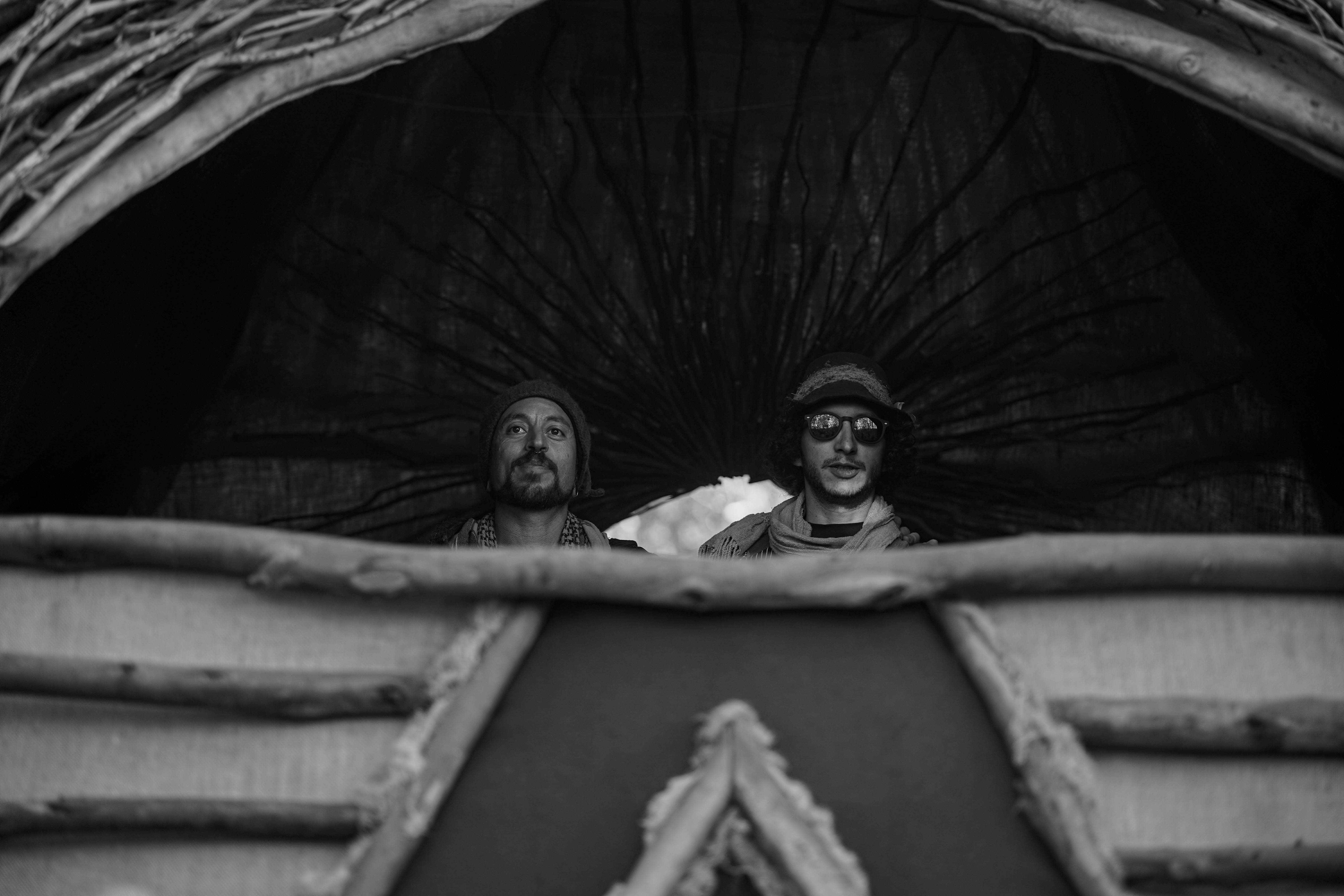 Akuandub captured mid-performance in warm lighting